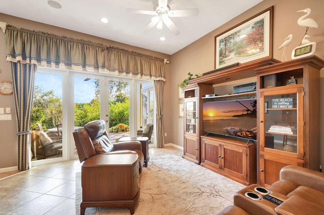 living room with light tile patterned floors, ceiling fan, and french doors