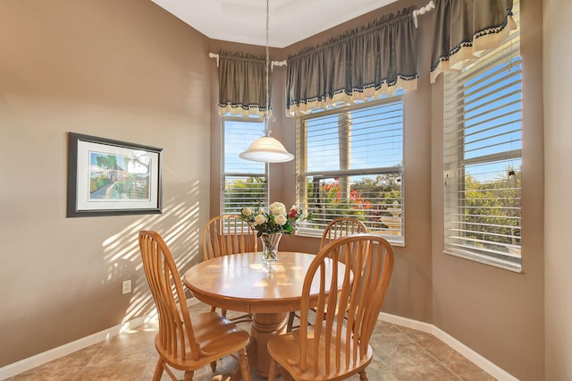 dining area with light tile patterned floors