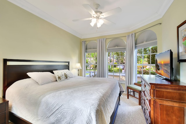 bedroom with access to outside, multiple windows, ceiling fan, and light colored carpet