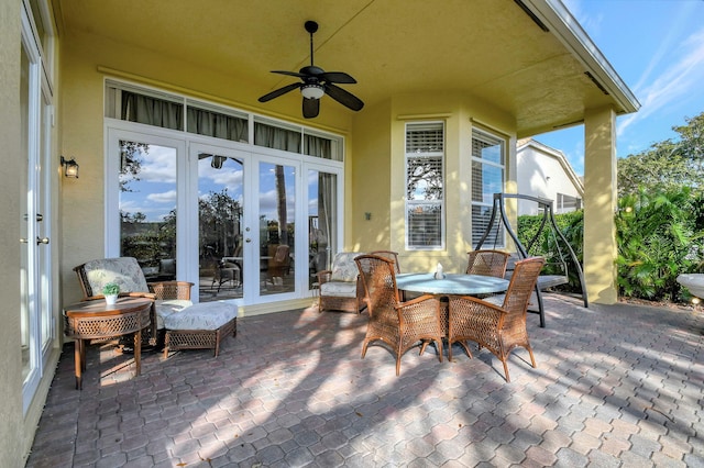 view of patio with french doors and ceiling fan