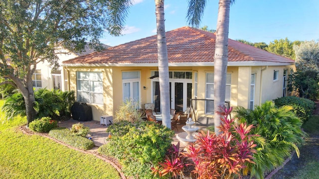 back of house featuring french doors