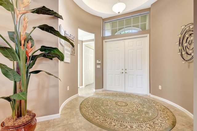 entrance foyer featuring light tile patterned flooring