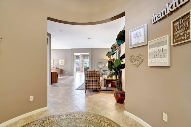 hall with light tile patterned floors