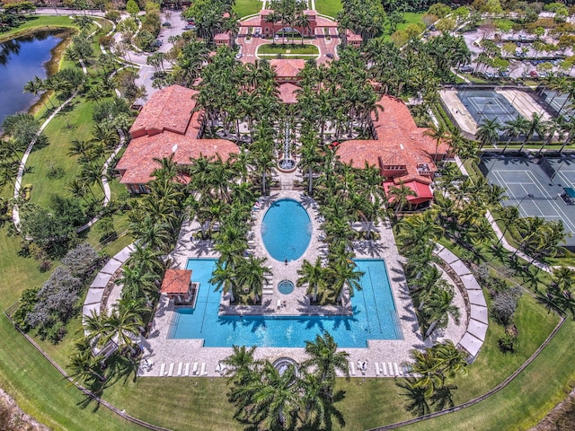 birds eye view of property with a water view