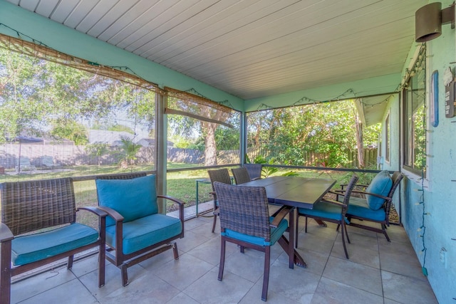 sunroom featuring wooden ceiling