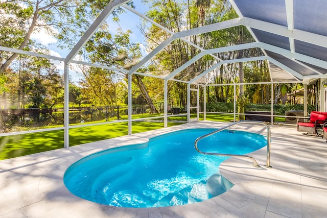 view of pool featuring a lawn, a lanai, and a patio