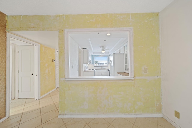 interior space with tile patterned flooring and white refrigerator