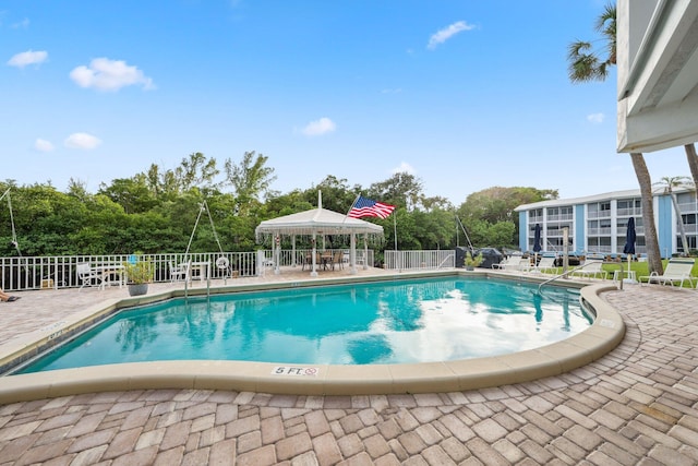 view of swimming pool with a patio area