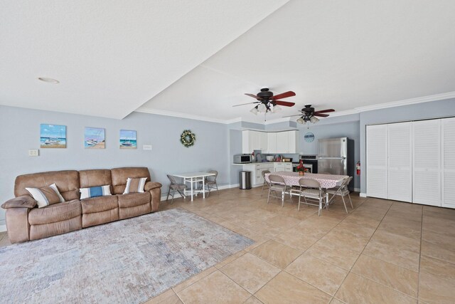 living room with ceiling fan, light tile patterned flooring, and crown molding