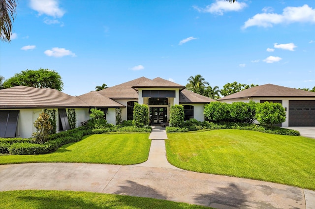 view of front of house with french doors and a front yard