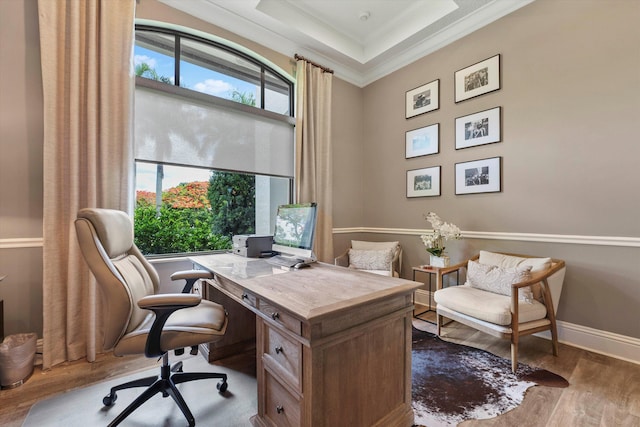 office with wood-type flooring and ornamental molding