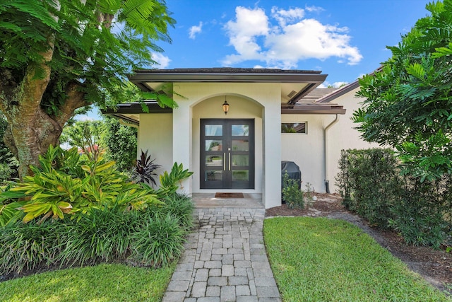 property entrance featuring french doors