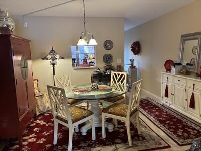 dining space featuring an inviting chandelier