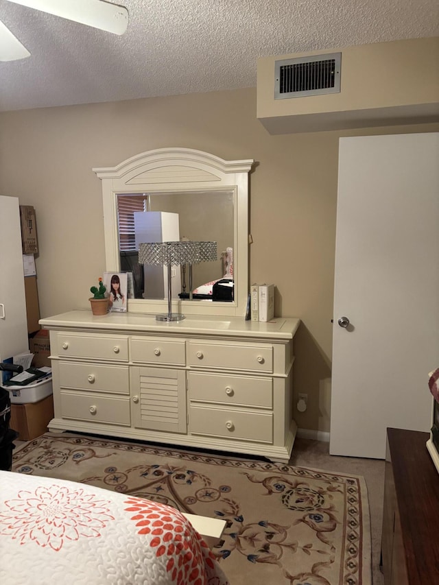 bedroom featuring a textured ceiling