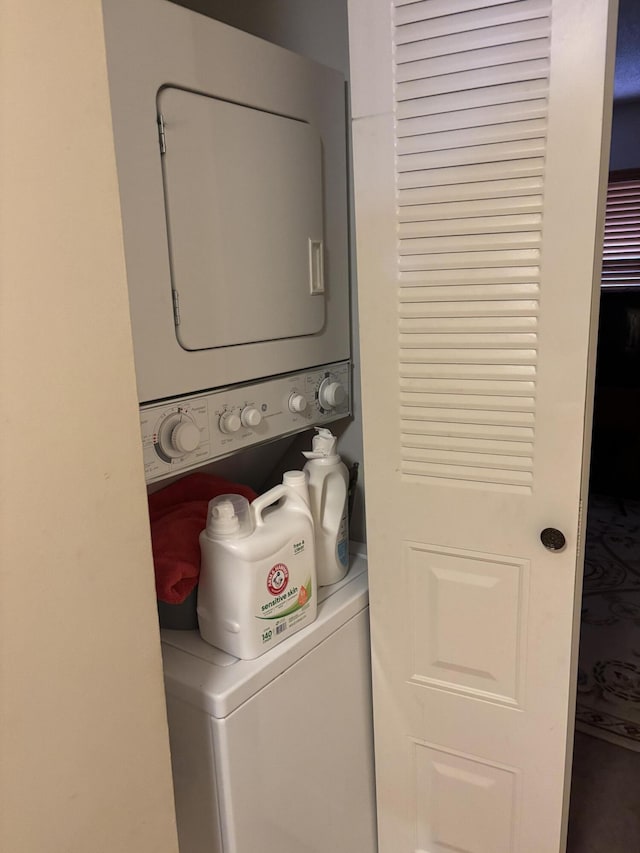 laundry room featuring stacked washer and dryer