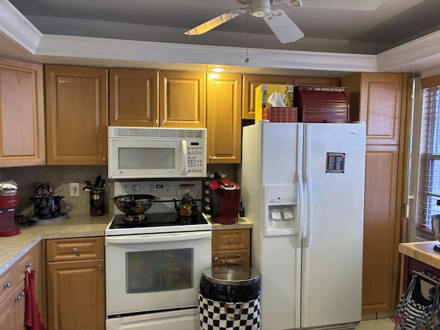 kitchen with white appliances, tasteful backsplash, and ceiling fan