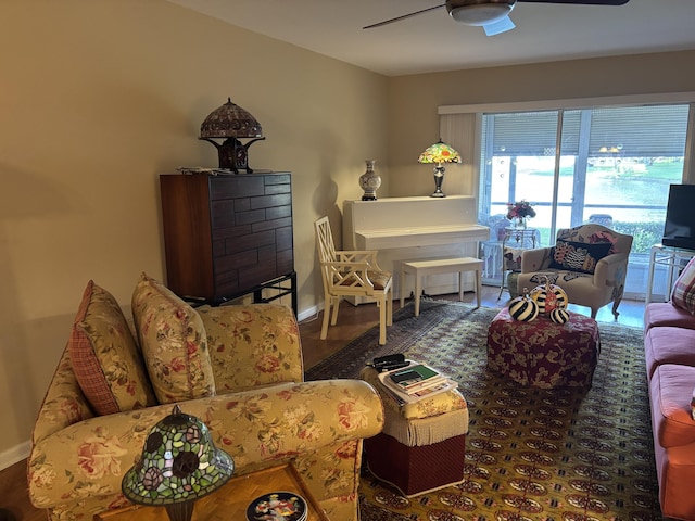 living room featuring ceiling fan and hardwood / wood-style floors