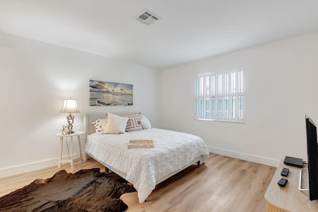 bedroom with wood-type flooring