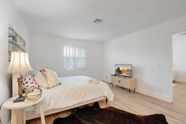 bedroom featuring hardwood / wood-style flooring