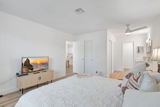 bedroom with ceiling fan and light wood-type flooring