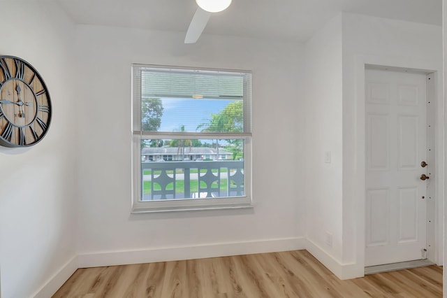 empty room featuring ceiling fan and light hardwood / wood-style floors