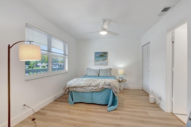 bedroom featuring ceiling fan and light hardwood / wood-style floors