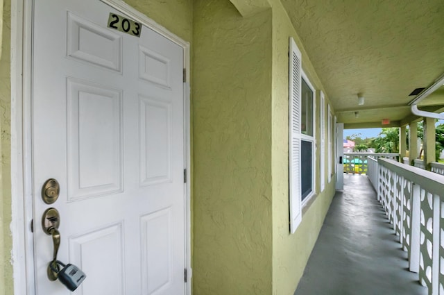 property entrance featuring covered porch