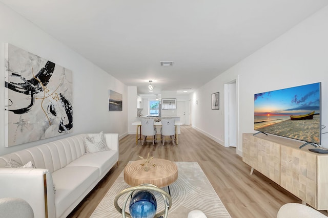 living room featuring light wood-type flooring