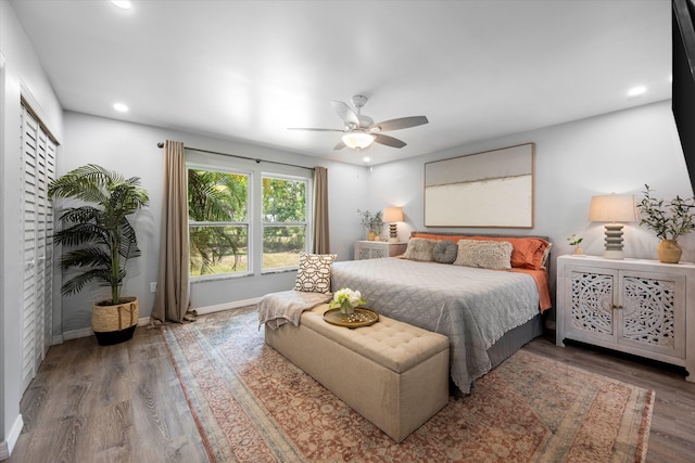 bedroom with hardwood / wood-style floors and ceiling fan