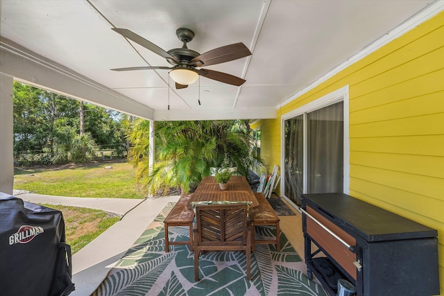 view of patio featuring area for grilling and ceiling fan