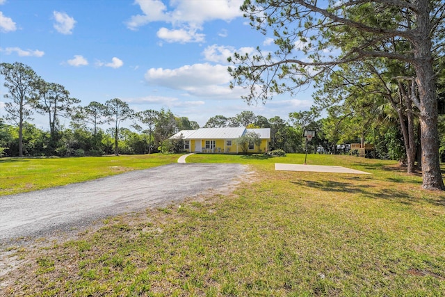 ranch-style house featuring a front lawn