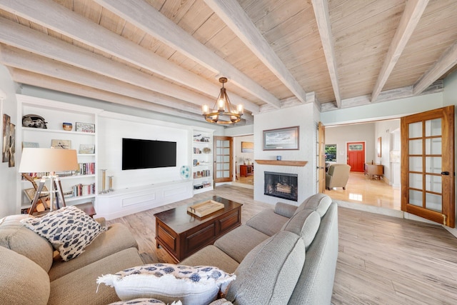 living room with wood ceiling, beamed ceiling, light hardwood / wood-style floors, and a chandelier