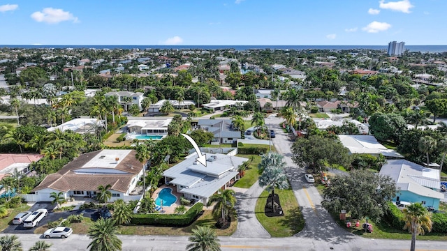 bird's eye view with a residential view and a water view