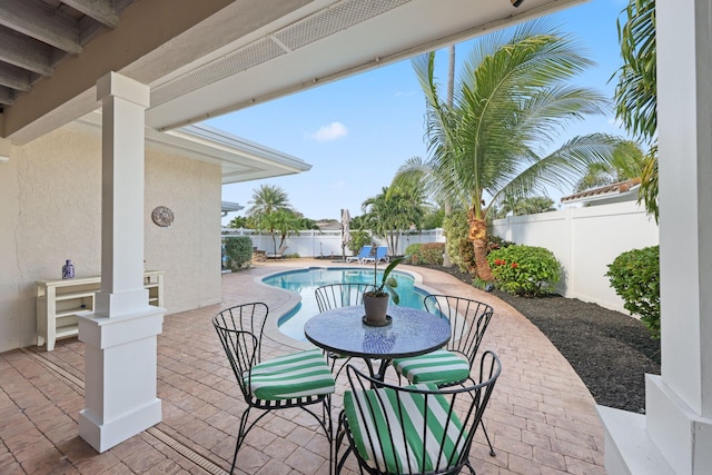 view of patio / terrace with a fenced in pool