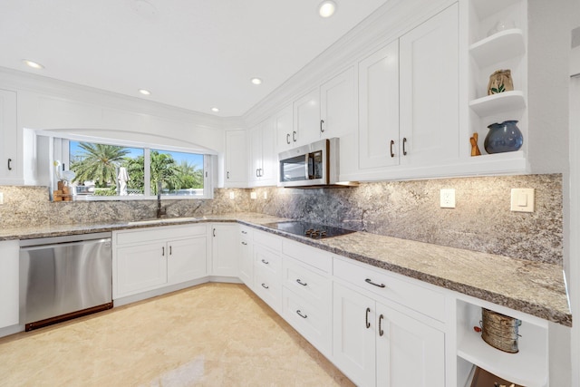 kitchen featuring light stone counters, open shelves, a sink, stainless steel appliances, and white cabinetry
