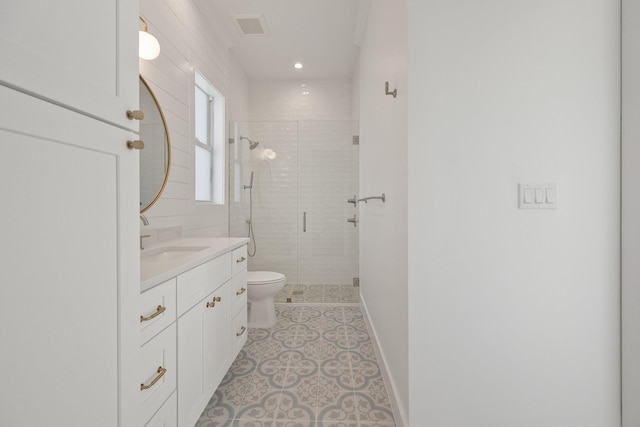 bathroom featuring walk in shower, tile patterned flooring, vanity, and toilet