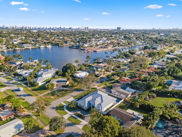 birds eye view of property with a water view and a residential view