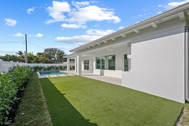 view of yard with a patio, a fenced backyard, and a fenced in pool