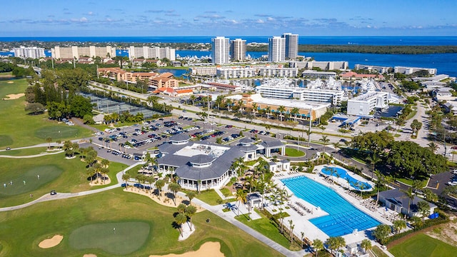 birds eye view of property featuring a view of city, a water view, and golf course view