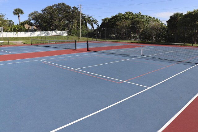 view of tennis court featuring basketball court