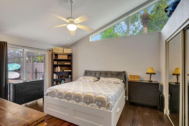 bedroom with ceiling fan, a closet, dark hardwood / wood-style flooring, and vaulted ceiling