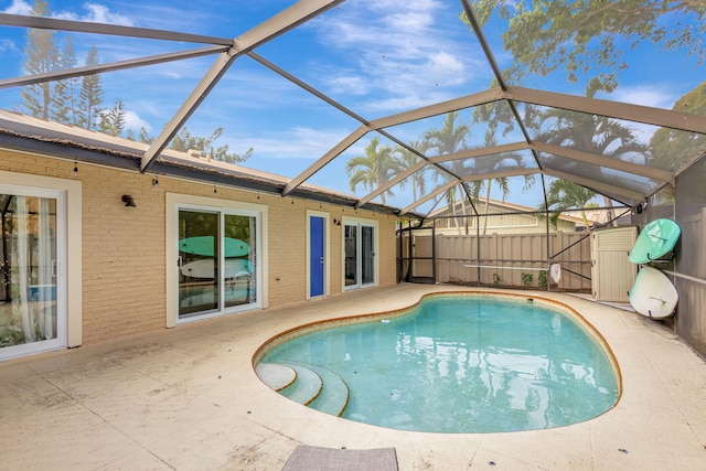 view of pool featuring a patio area and a lanai