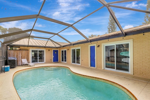 view of pool featuring a lanai and a patio area