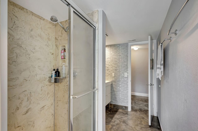 bathroom with tile patterned flooring, vanity, and an enclosed shower