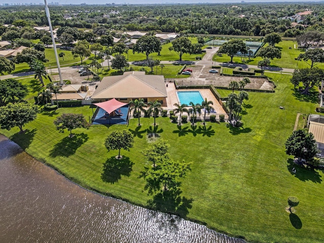 birds eye view of property with a water view