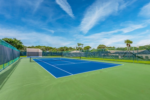 view of tennis court featuring basketball court