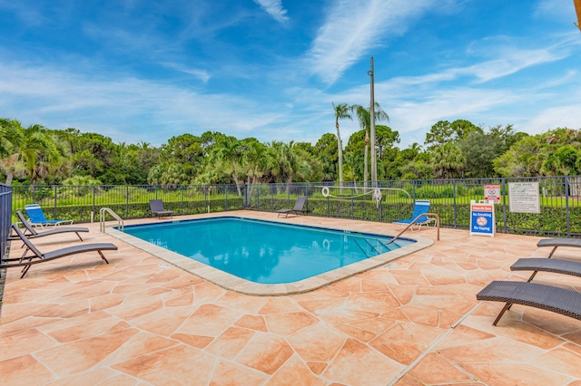 view of pool featuring a patio area