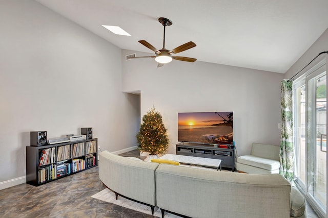 living room featuring ceiling fan and vaulted ceiling