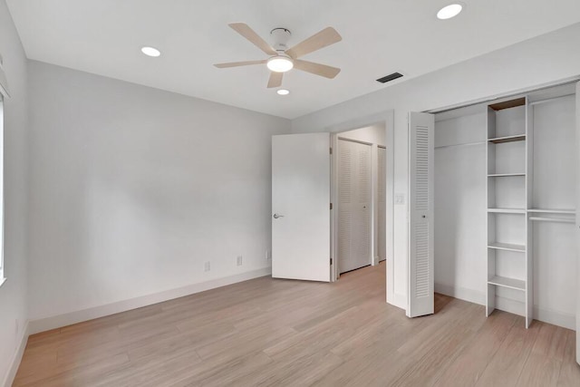 unfurnished bedroom featuring ceiling fan and light wood-type flooring