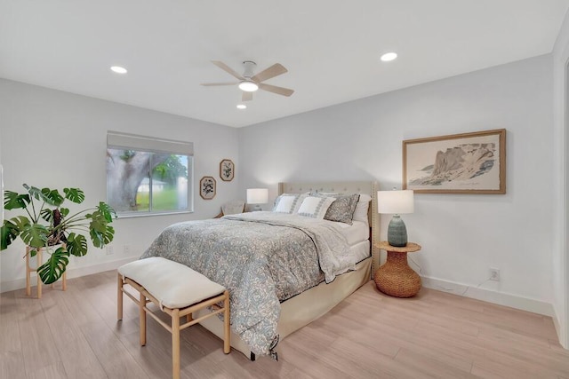 bedroom featuring ceiling fan and light hardwood / wood-style flooring